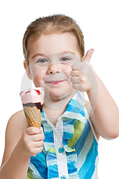 Joyful kid girl eating ice cream in studio isolated