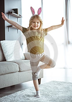 Joyful kid playing at home with joy