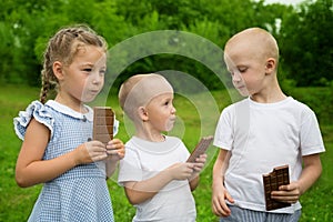 Joyful kids eating chocolate