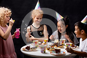 Joyful kids enjoying time during birthday party