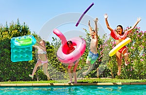 Joyful kids having fun during summer pool party