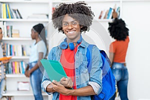 Joyful laughing afro american male college student