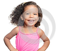 Joyful little girl with an afro hairstyle smiling