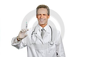 Joyful male doctor with syringe.