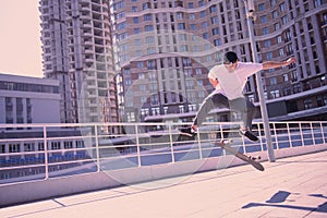 Joyful male person jumping high in park