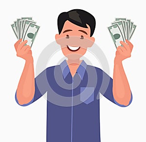 Joyful man with banknotes of money in his hands. The concept of wealth.