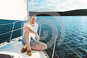 Joyful Man Sitting On Yacht Boat Deck Sailing Across Sea