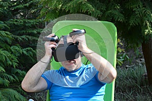 Joyful man with virtual reality headset