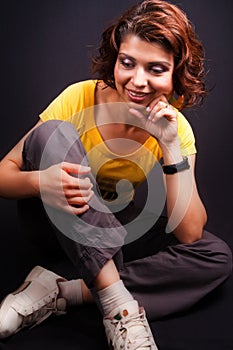 Joyful middle aged woman sitting down