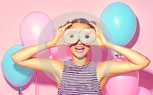 Joyful model beauty girl holding donuts