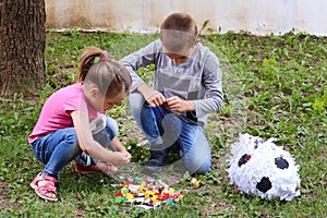 Joyful Moments: Kids Enjoying Candy from a Broken Piñata