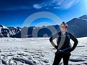 Joyful mountaineer in the snow-covered Polish Tatras