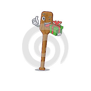 Joyful oars cartoon character with a big gift box