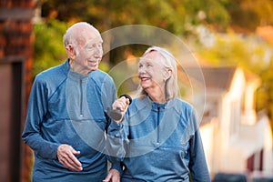 Joyful older couple walking outdoors