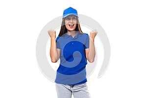 joyful pretty young brunette woman in blue cap and t-shirt with print mockup on white background with copy space