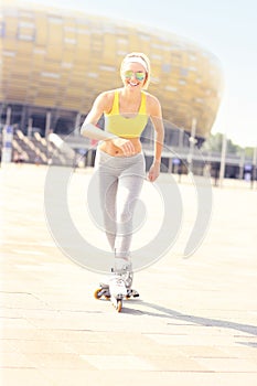 Joyful roller blader in front of Amber Stadium