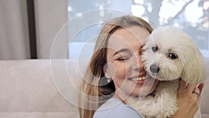Joyful Smiling Attractive Young Woman Hugging Cute Doggy.