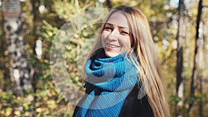 Joyful smiling beauty blond woman in autumn colorful park, slow motion. 3840x2160