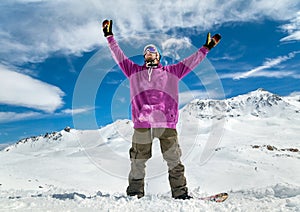 Joyful Snowboarder in the mountains