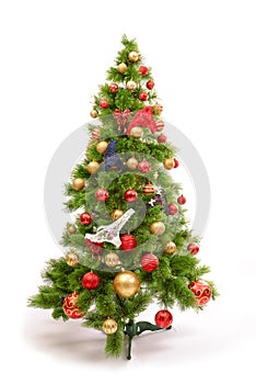 Joyful studio shot of a Christmas tree with colorful ornaments, isolated on white