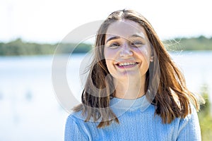 Joyful Style: Girl's Radiant Smile in Nature