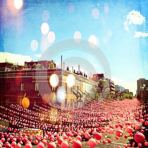 Joyful summer street in gay neighborhood decorated with pink balls