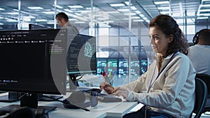 Joyful technician working in high tech data center workspace