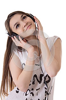 Joyful teen girl with headphones listens to the music