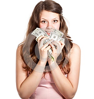 Joyful teenage girl with dollars in her hands
