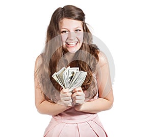 Joyful teenage girl with dollars in her hands