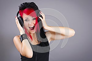 Joyful teenage girl listening to the music