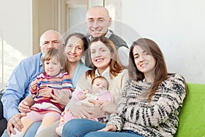 Joyful three generations family in home