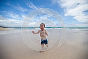 Joyful toddler on a tropical beach