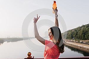 Joyful white woman posing on sky background with smile. Outdoor portrait of inspired sporty girl wi