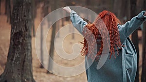 Joyful woman in autumn park.