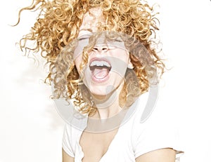 Joyful woman with curls