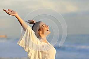 Joyful woman enjoying a day on the beach