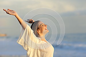 Joyful woman enjoying a day on the beach photo