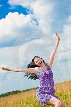 Joyful woman in the field