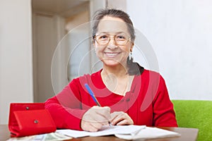 Joyful woman fills in the questionnaire