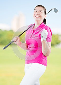 joyful woman golfer enjoys his victory