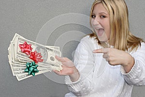 Joyful woman with Holiday money photo