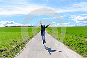 Joyful woman jumping in the air celebrating