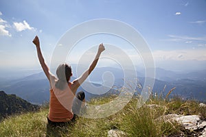 Joyful woman on mountain top