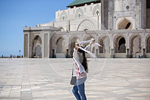 Joyful Woman With Scarf at Mosque Courtyard