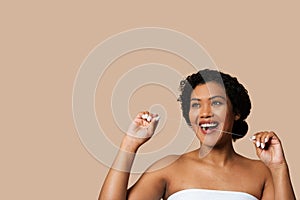 Joyful Woman With Short Curly Hair Flossing Teeth