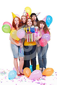 Joyful women with gifts and balloons