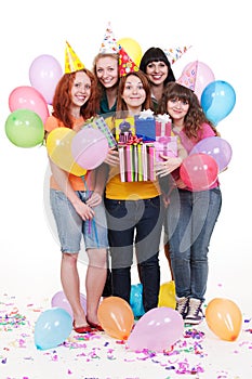 Joyful women with gifts and balloons