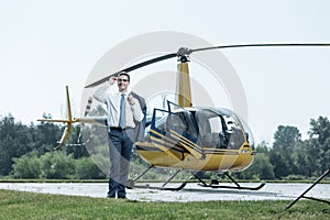 Joyful young businessman waiting for private pilot