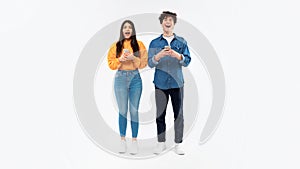 Joyful Young Couple Using Cellphones With Opened Mouth, White Background